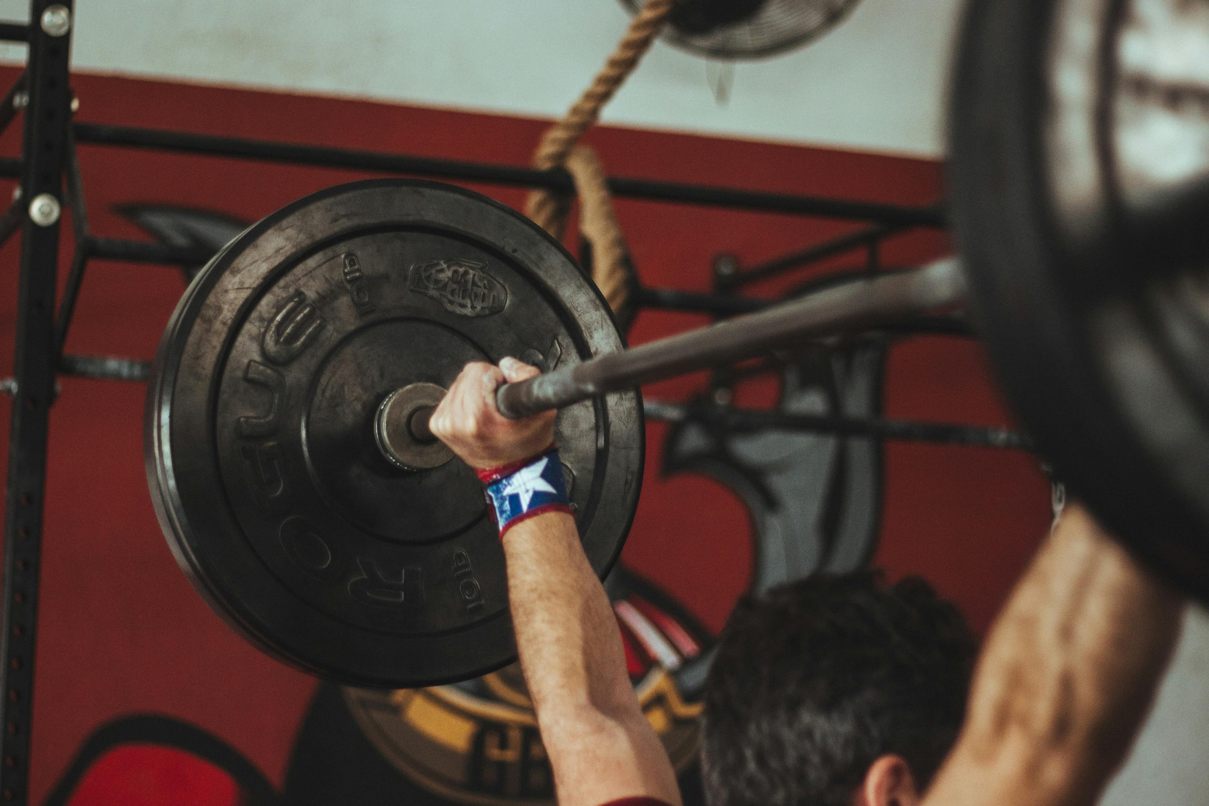 Dark gym with weights and dramatic lighting — fits the aesthetic tone of the blog perfectly. If you want an alternate